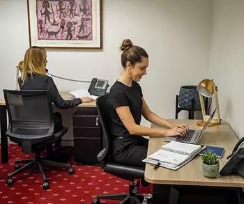 Coworking freedom in Emirates Towers, Duba, were two ladies are working 